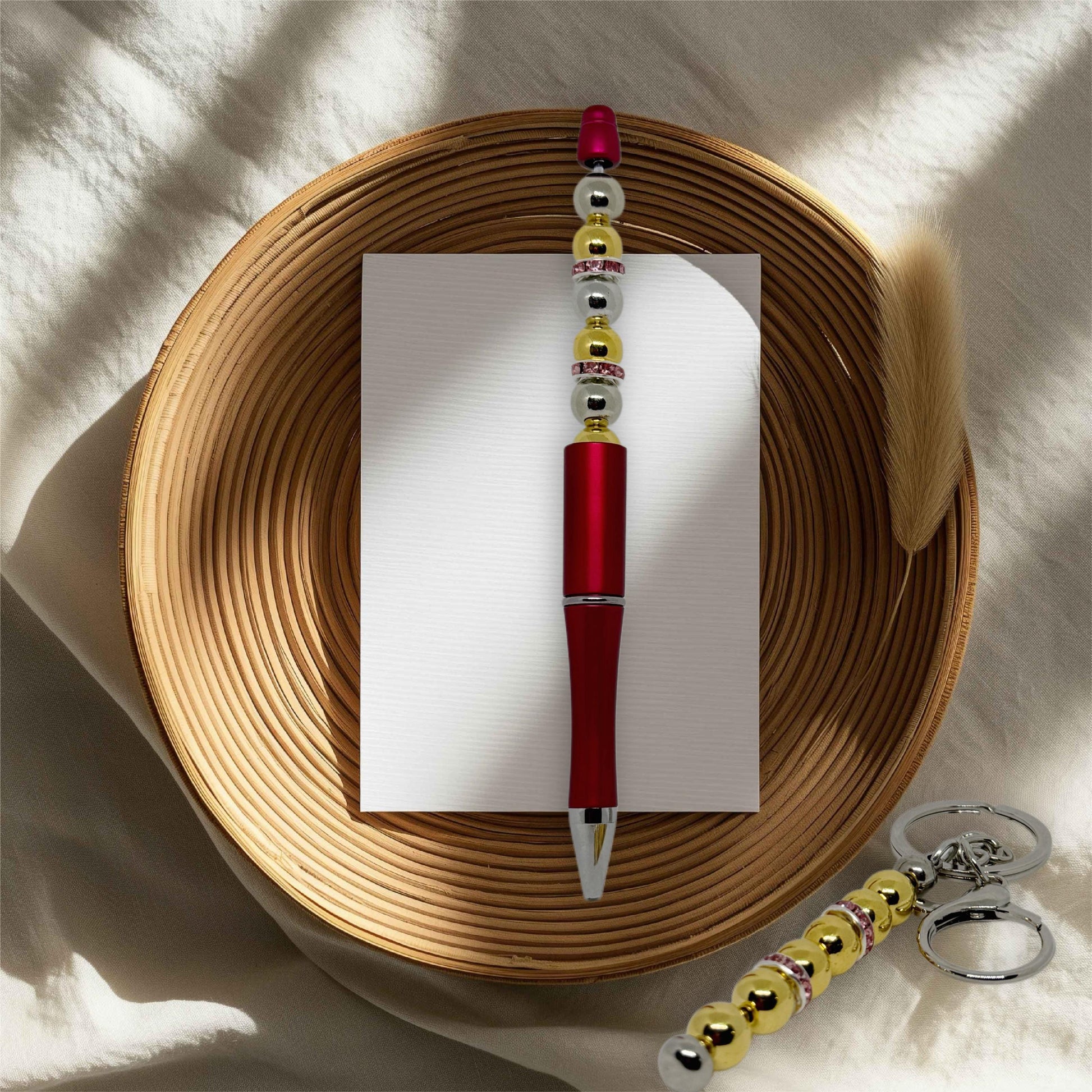 Elegant Red Pen and Golden Keychain Set